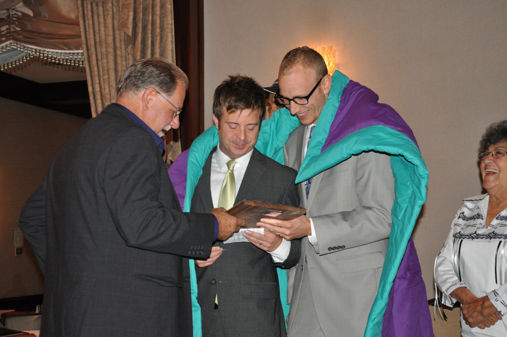 Allen Benson presents us with our plaque, acknowledging our contribution to Native Counselling Services of Alberta.